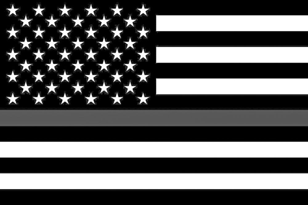An American flag with one of the white lines made grey 