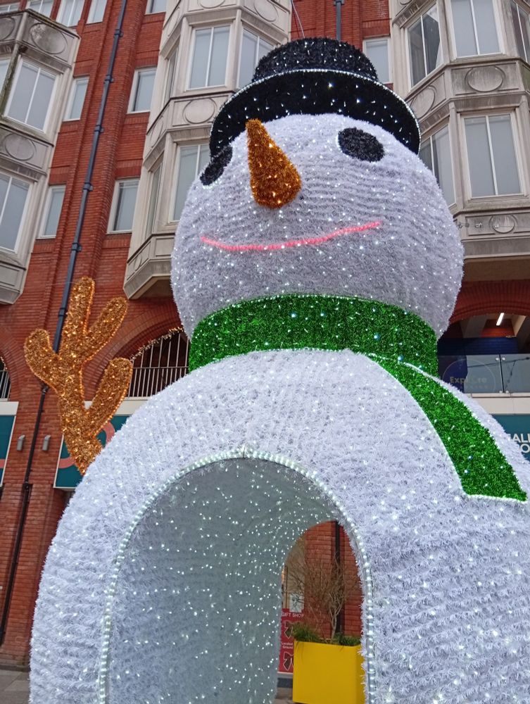 A giant snowman with a walkthrough arch in his middle. 