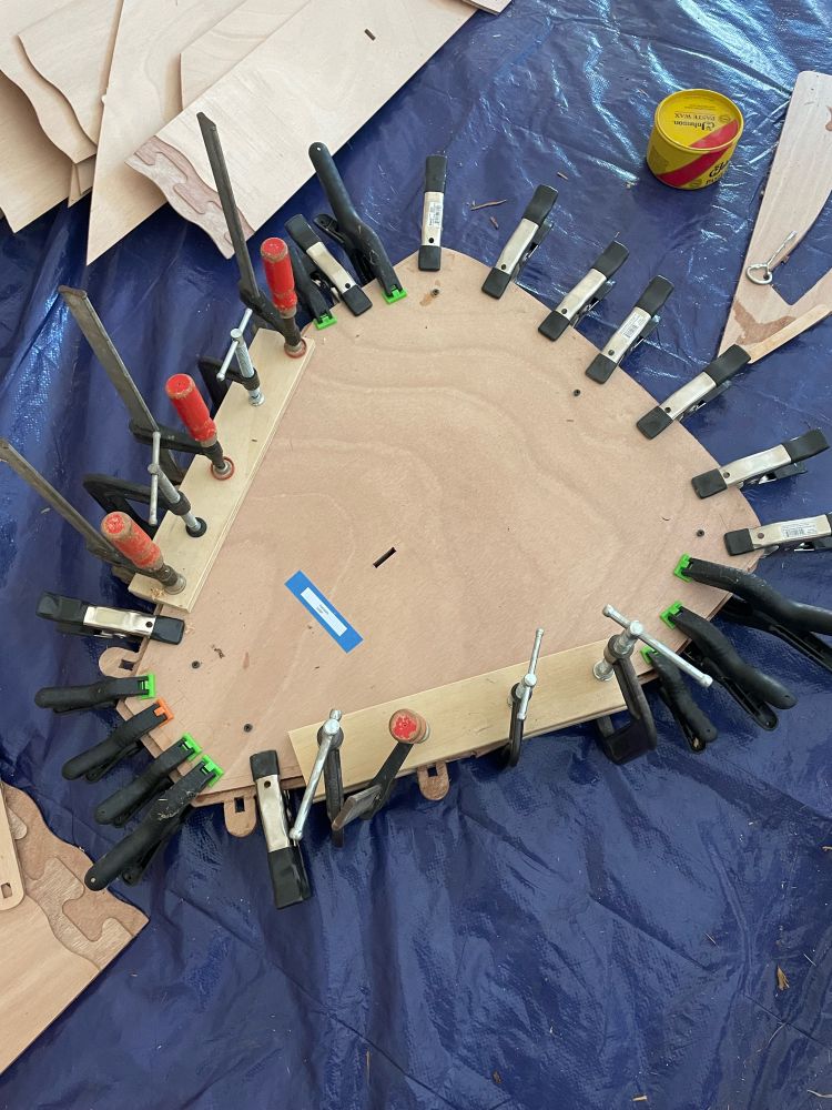 A boat transom being clamped together.