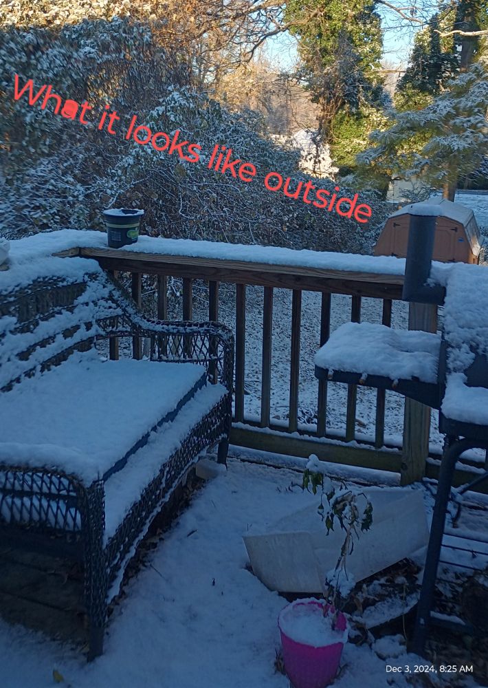 Picture of exterior deck covered in snow. Caption what it's like outside