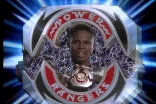 a picture of a power rangers logo with a man in the center