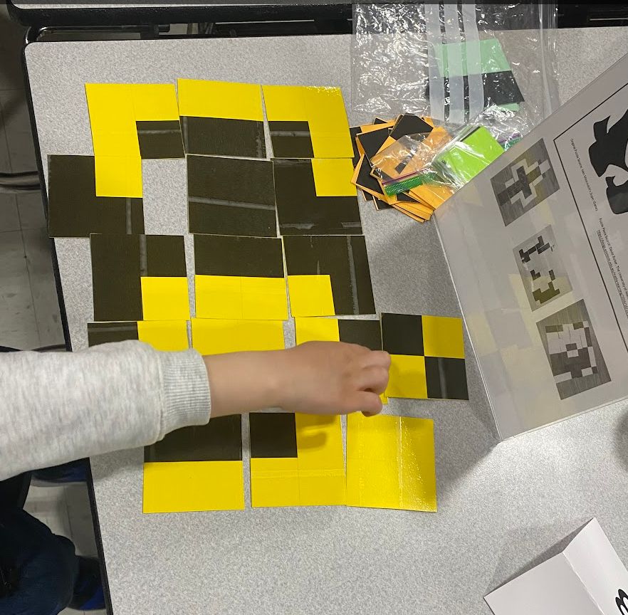 yellow and black squares matched up to match colors. this puzzle can be explored in lots of different ways.
