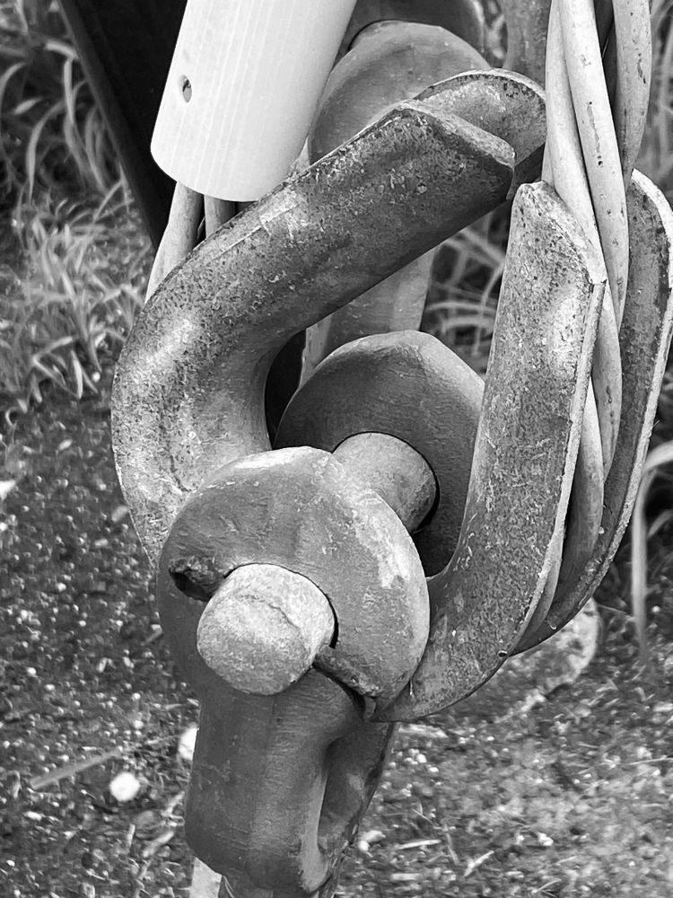 black and white seems to emphasize the industrial feel of the heavy steel anchor for a power transmission tower, near cleveland OH