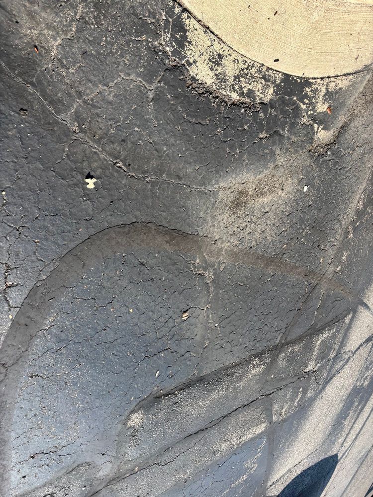 accidental cell phone photo of an asphalt parking lot… a curious abstraction