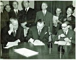 Lord Chancellor Jowitt (left), Justice Jackson (center) and Judge Falco at the signing of the London Charter.