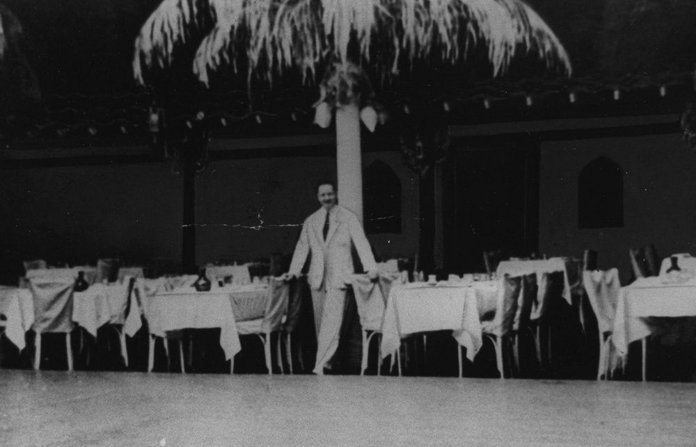 Angelo Lippi, the maitre d' of the Cocoanut Grove nightclub, poses in the main dining room sometime before the devastating fire. Photo courtesy of National Fire Protection Assoc.