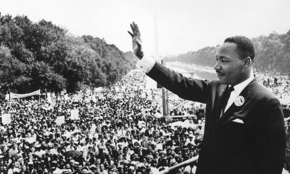 Civil rights leader Martin Luther King Jr. waves to the crowd at the Lincoln Memorial in Washington, D.C., where he gave his 
