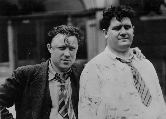 Walter Reuther (left) and Richard Frankensteen after being beaten by Ford security during the 