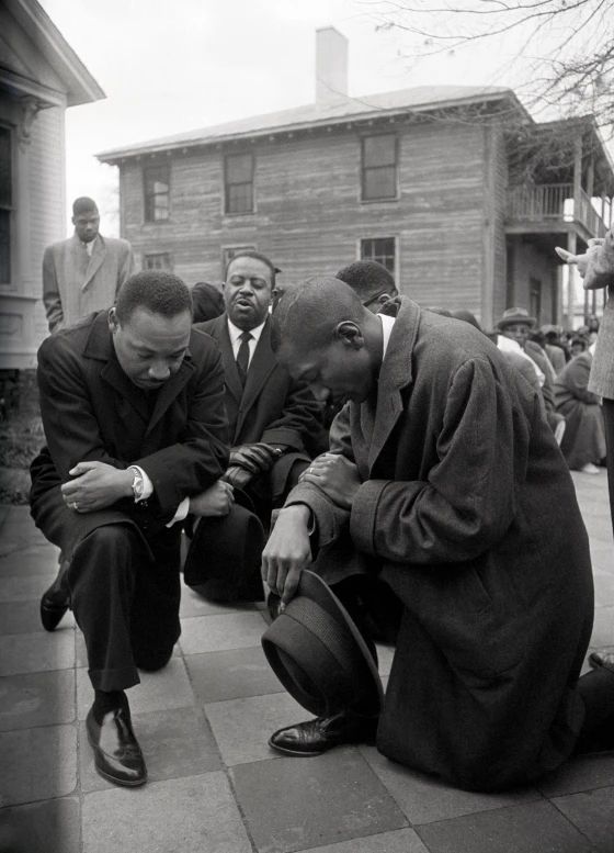 Rev. Frederick Douglas Reese (right) kneels in prayer with MLK and others before going to jail in Selma, Ala. They were arrested Feb. 1, 1965, after protesting Alabama's voter registration requirements. After the prayer, they all marched peacefully to jail. Photo credit: Bettmann Archive.