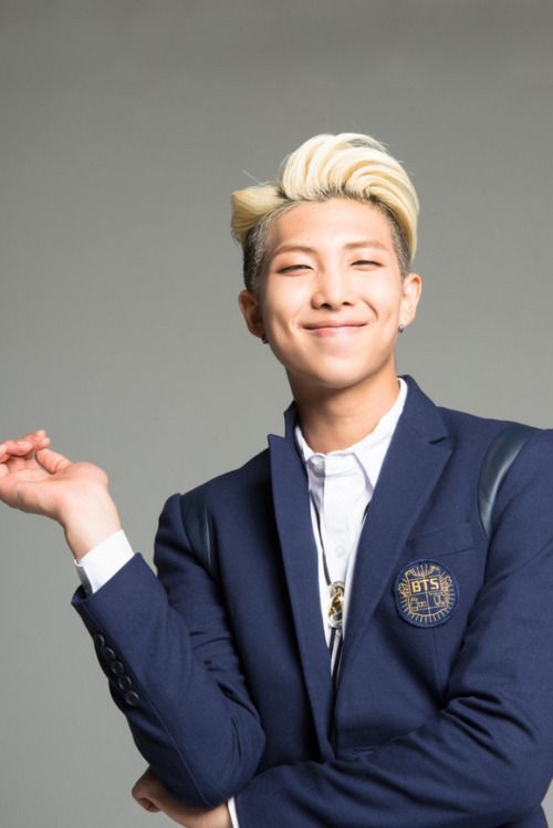 handsome Namjoon in a navy blazer with his ice cream hair back in Red Bullet era