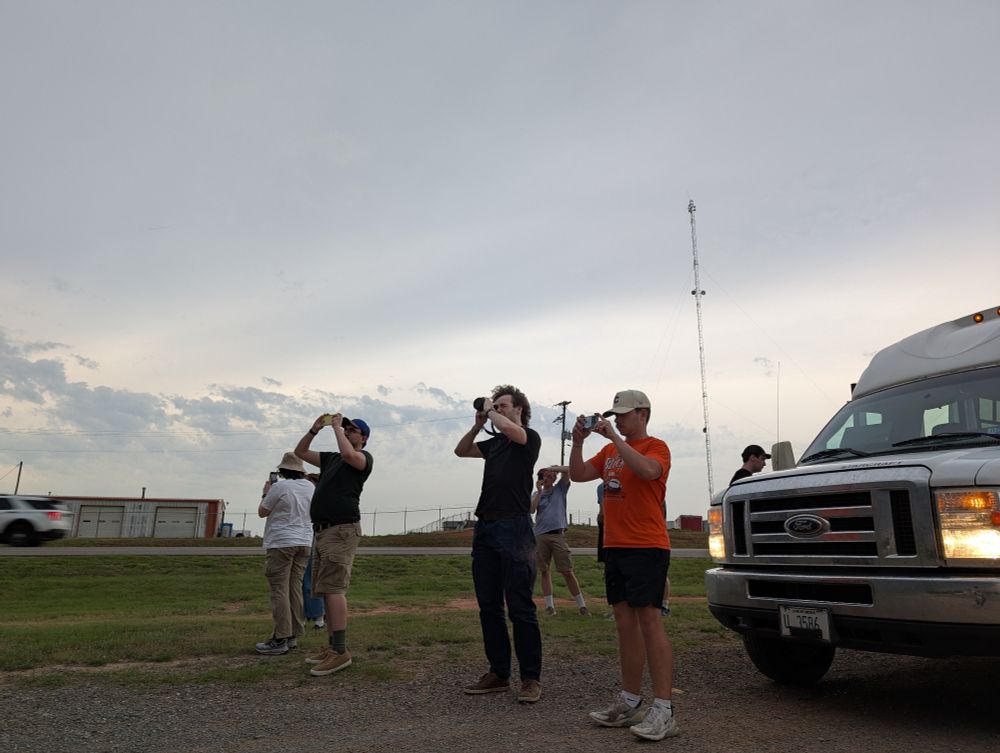 Students photographing a storm