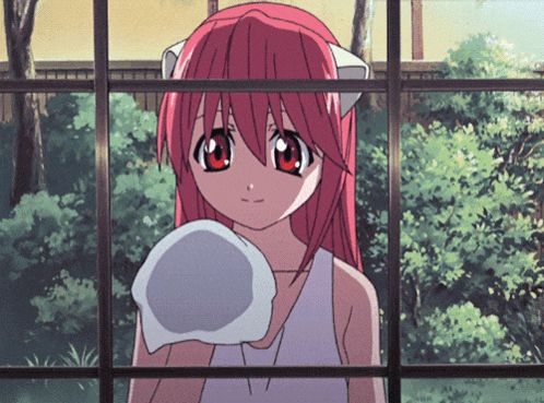 a girl with red hair is holding a white towel in her hand