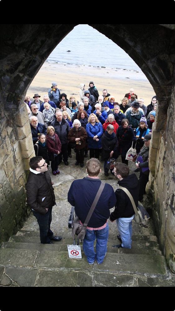 Singing beneath Sandwell gate medieval archway in Hartlepool 