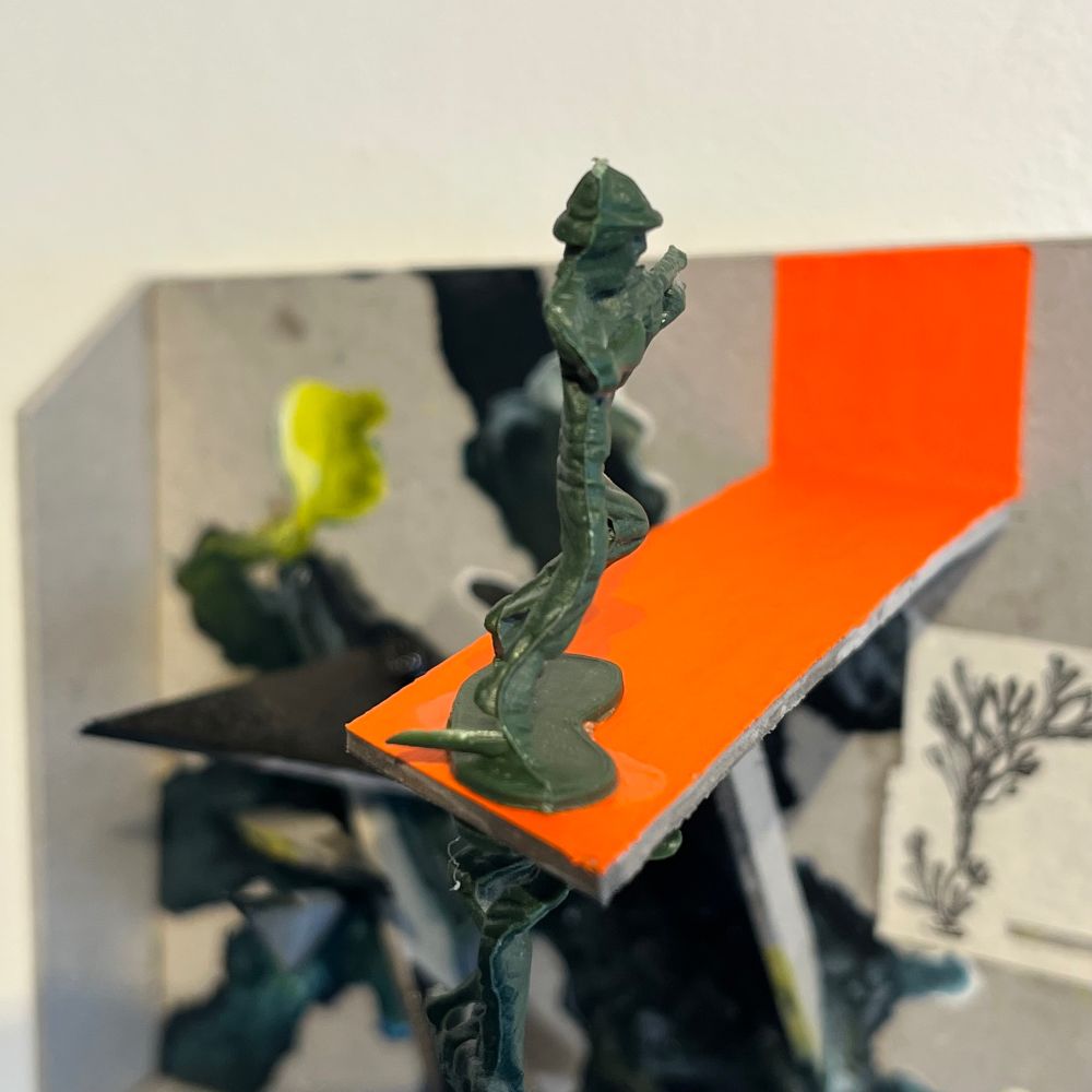 A view on the top plastic soldier on his orange plank