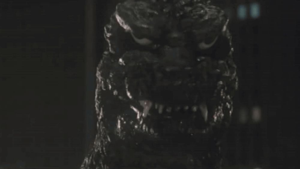 a close up of a monster 's face with a very angry look on it 's face .