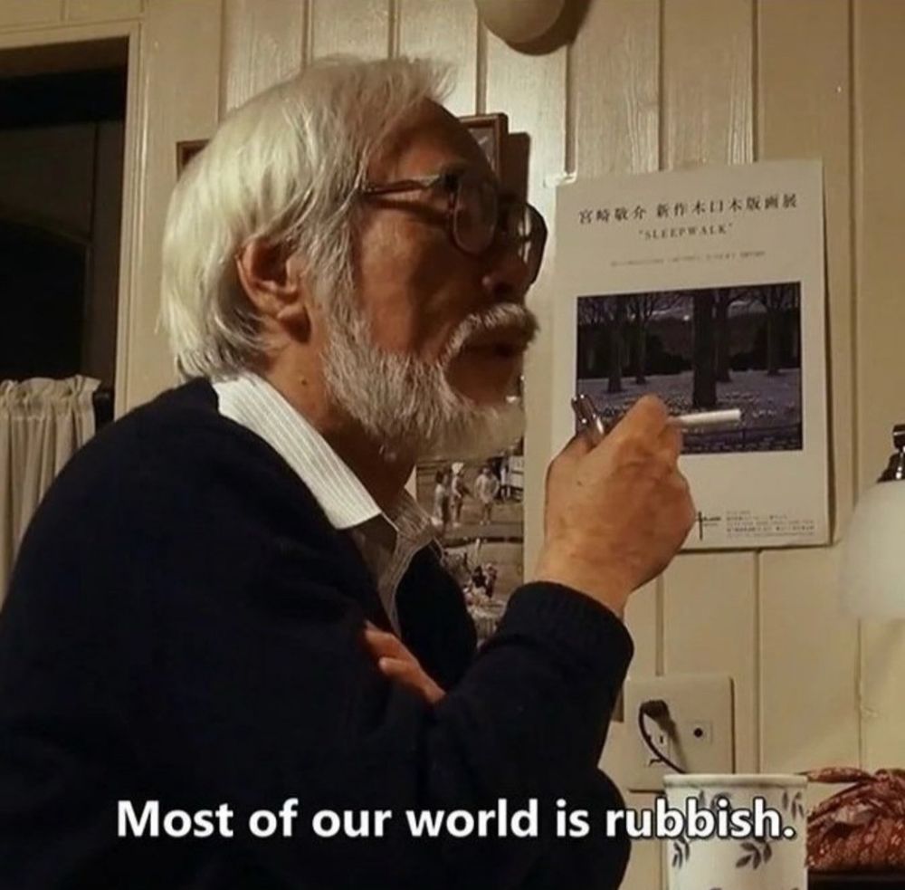 Miyazaki smoking a cigarette with the caption "most of our world is rubbish"