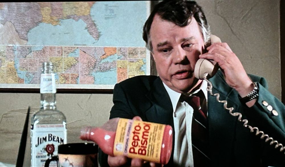 Joe Don Baker in Cape Fear (1991) where he's pouring himself a concoction of jim beam and pepto