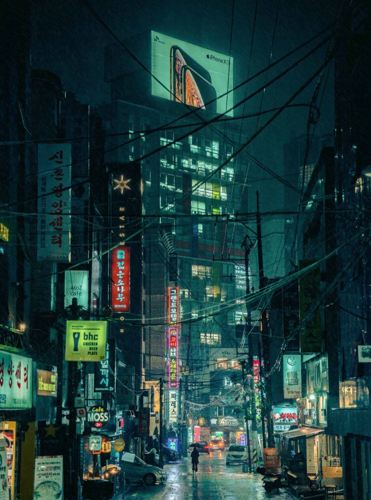 Street photography: Rainy night in Korea, neon lights illuminating the scene.
