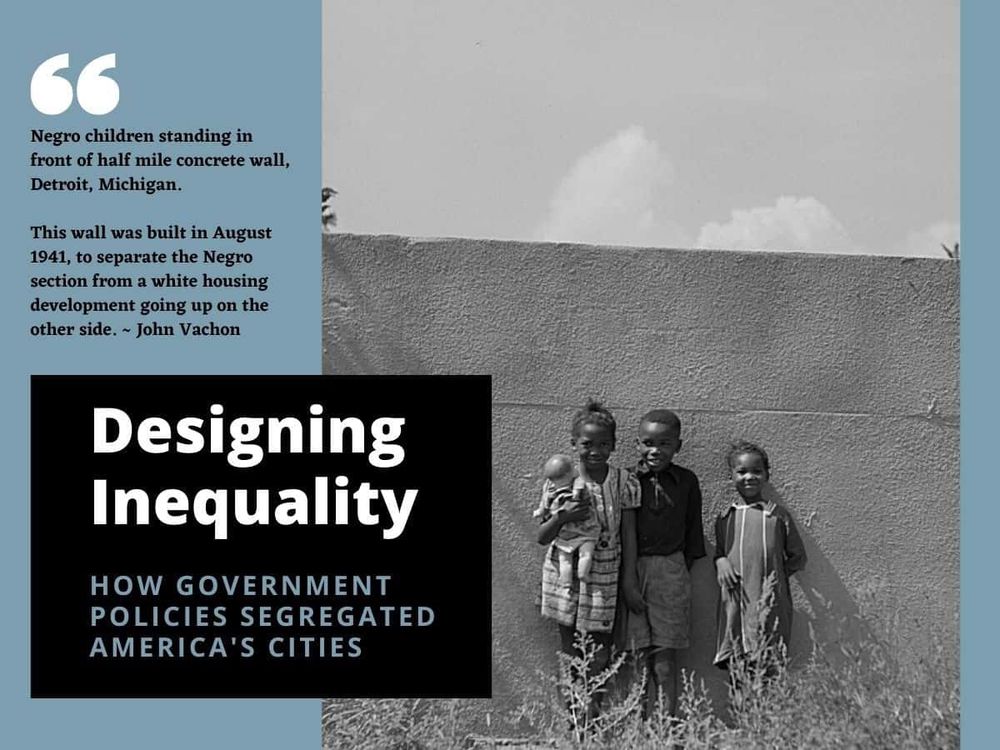 A historical black-and-white photograph showing four young Black children standing in front of a tall concrete wall in Detroit, Michigan. The wall, built in August 1941, was constructed to separate Black neighborhoods from a white housing development. A quote by John Vachon reads: ‘Negro children standing in front of half mile concrete wall, Detroit, Michigan. This wall was built in August 1941, to separate the Negro section from a white housing development going up on the other side.’ The image is part of a graphic titled ‘Designing Inequality: How Government Policies Segregated America’s Cities.