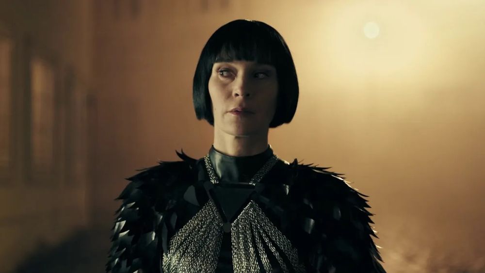 Still from Therapy For A Vampire. A vampire wife, with a severe pageboy and a striking black and silver outfit, experiences the 700 year itch. 