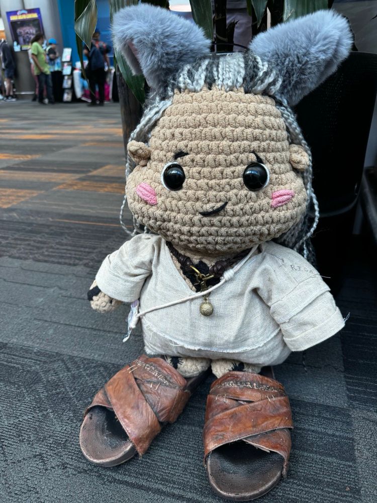 Crochet Ed teach wearing cat ears and huge sandals 