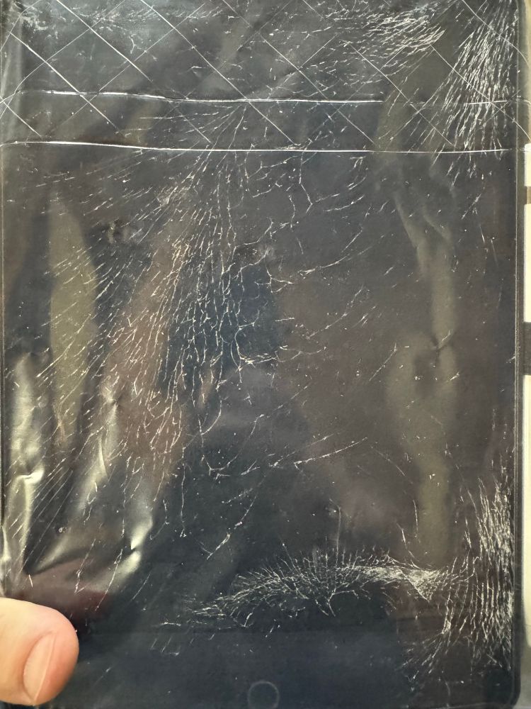 An iPad with a VERY cracked screen 