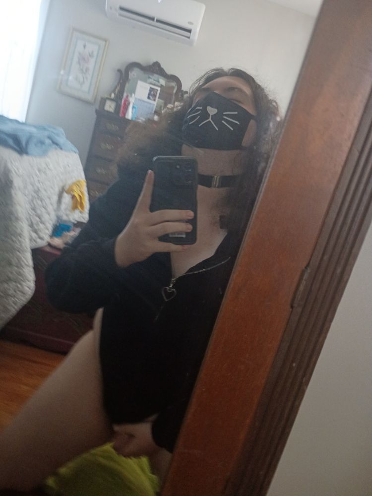 Ruby stroking herself and looking up, showing off her choker