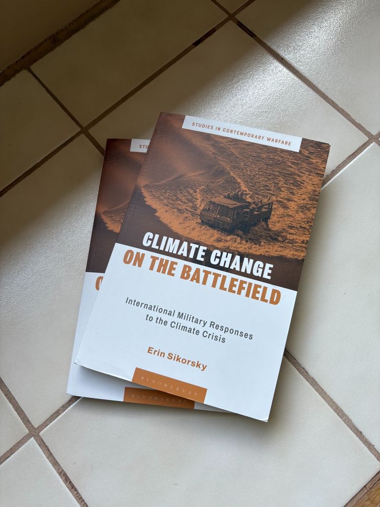 Picture of a book, Climate Change on the Battlefield, by Erin Sikorsky.