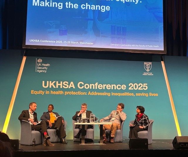 Photo of the panel discussion, with Bola Owolabi, Greg Fell, Shona Arora, Dave Buck and Adam Briggs.