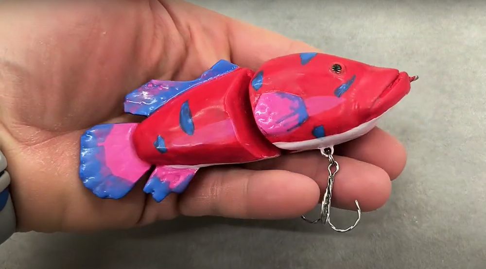 A brightly coloured fishing lure based on the Ruby Splashtail from Sea of Thieves.