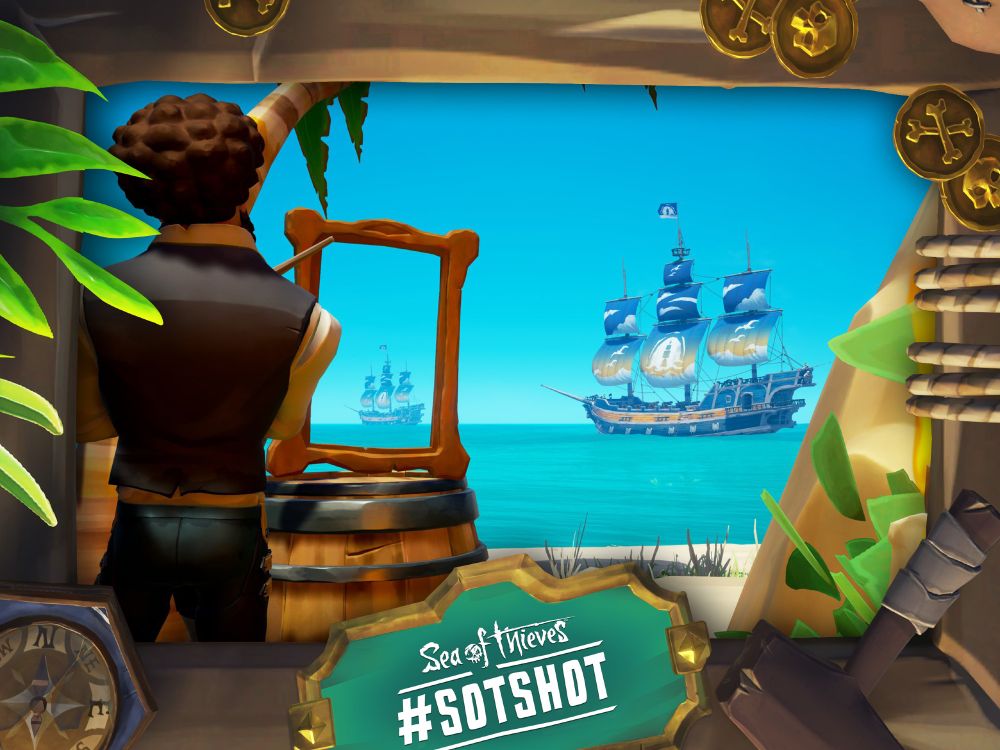 A framed screenshot of Sea of Thieves showing a pirate 'painting' a version of the ship just off the shore.