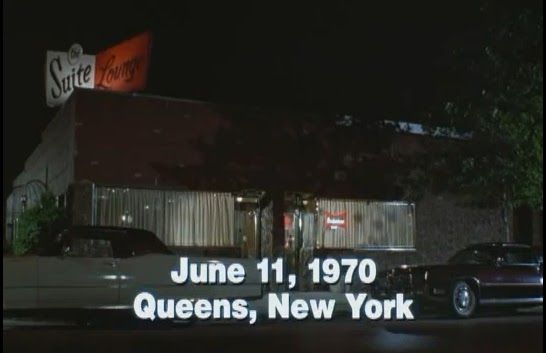 A screengrab from Goodfellas: the exterior of a diner, at night, captioned June 11th, 1970 Queens, New York.