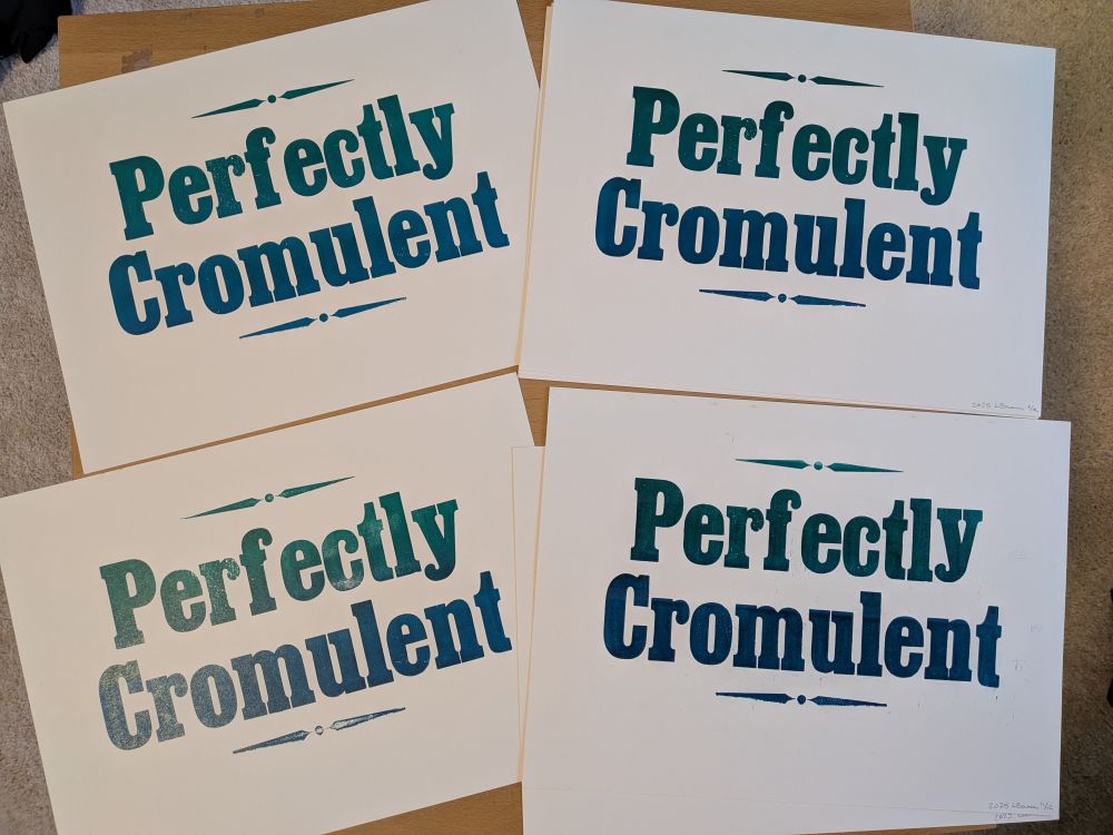 Four letterpress prints of the phrase "Perfectly Cromulent" in a green/blue gradient