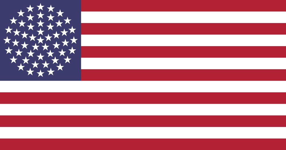 A 51-star flag. It looks like the current flag but the upper left field of blue is now adorned with 51 stars arranged in a circle within which there are 5 triangles of 10 stars each, arranged in a circular pattern around a central star. Another way to describe it would be a five-armed asterisk made of stars, with four stars in each arm and a central star, and a 6-star 1-2-3 pyramid in between each of the arms of the asterisk.