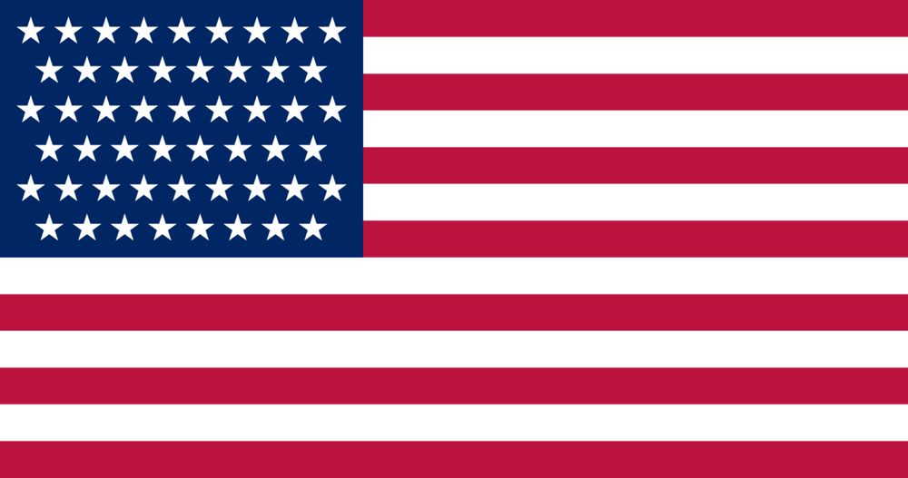 A 51-star flag. It looks like the current flag but the upper left field of blue is now adorned with 51 stars arranged in three rows of 9 stars and three rows of 8 stars, alternating between the two. The visual impact is very similar to the current 50-star flag with alternating 6- and 7-star rows.