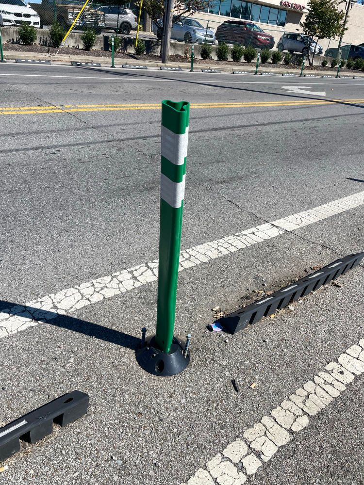 New bollard in process of being screwed into the ground 