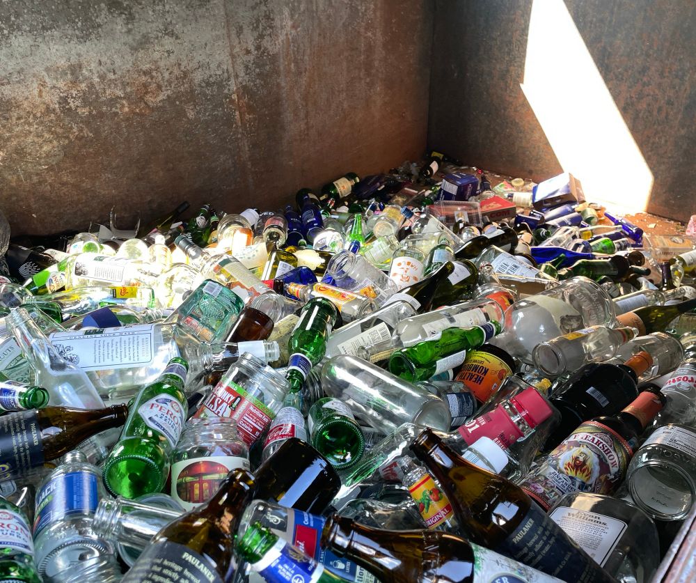 Inside the glass bin. Lots of glass bottles.