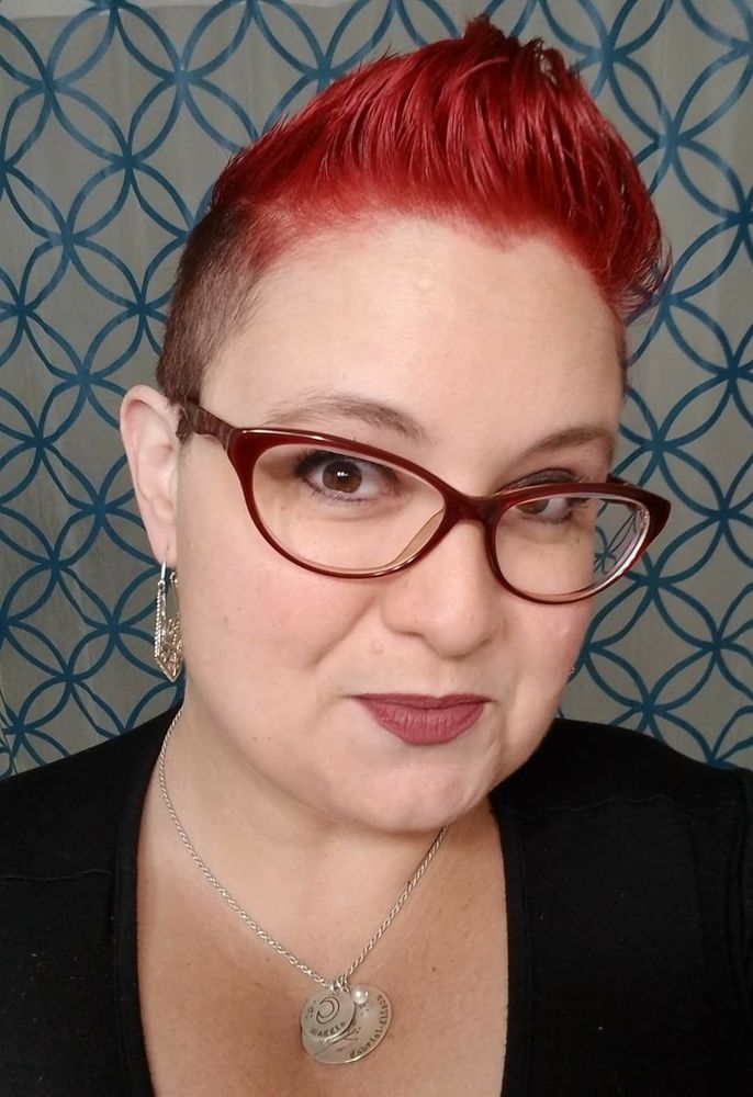 A photo of me with a bright red fauxhawk 