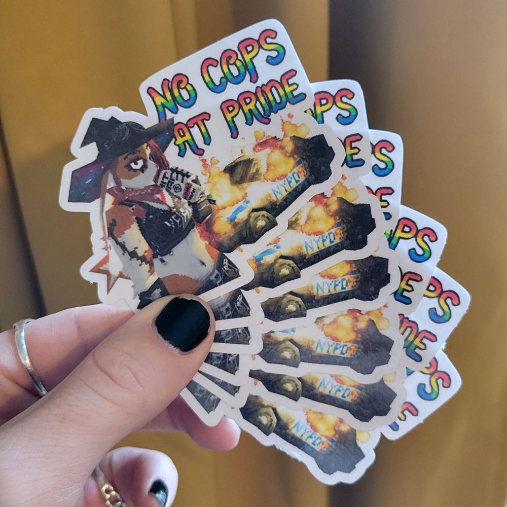 a splay of 6 'no cops at pride' stickers with bunlith drinking a white paw in front of a burning cop car