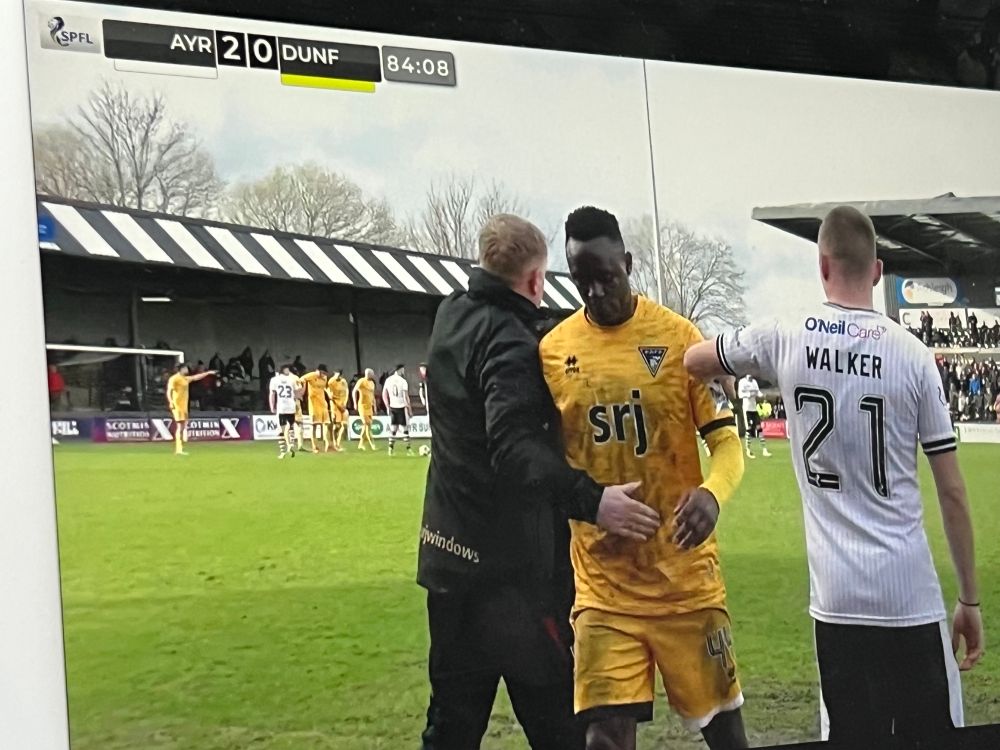 AUTV: Victor Wanyama heads off for an early bath, with Neil Lennon giving him a hug to send him on his way.