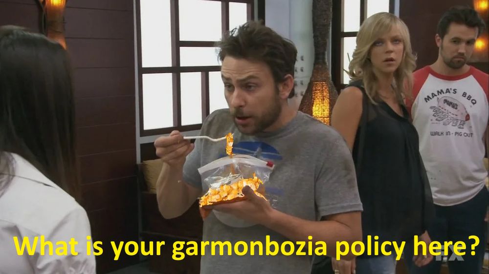 twin peaks sunny in Philadelphia meme mashup it's Charlie holding a bag of creamed corn asking "What's your Garmanbozia policy here?" garmonbozia represents pain and sorrow