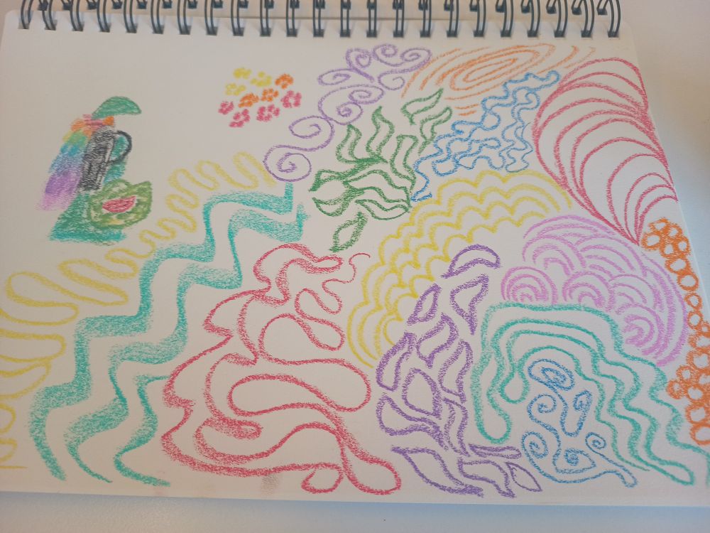 Spiral notebook, soft pastels drawings, lots of brightly coloured squiggles and different patterns