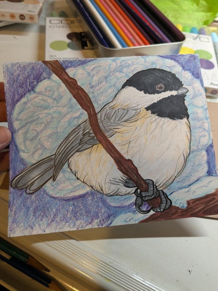 A small hand-drawn card showing a black-capped chickadee perched on a branch, with a vaguely-rendered human brain in the background.