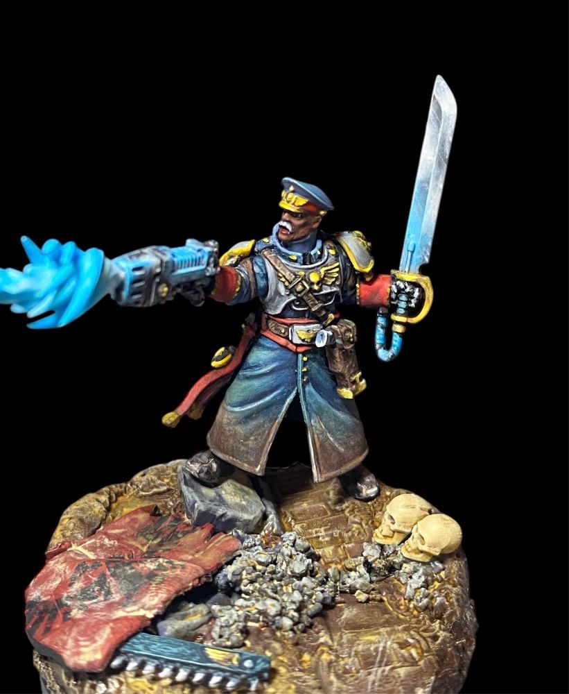 Cadian castellan in a grey blue coat standing above a ripped imperial flag on a muddy battlefield, shooting a plasma bolt from his pistol and holding a power sword