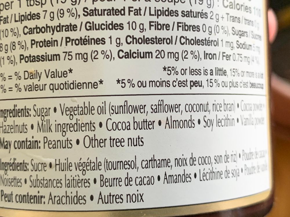 
Inpredients: Sugar * Vegetable oil (sunflower, safflower, coconut, rice bran) * Cocoa powder * 
Hazelnuts *  Milk ingredients:   Cocoa butter *  Almonds * Soy lecithin  *Vanilla powder.
May contain: Peanuts & Other tree nuts

