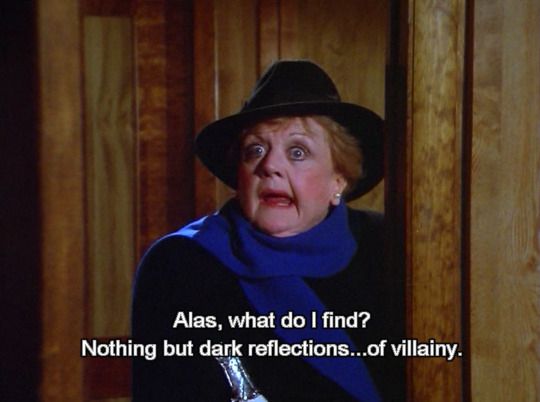 screenshot of Angela Lansbury looking horrified. The screen caption reads "Alas, what do I find? Nothing but dark reflections...of villainy."