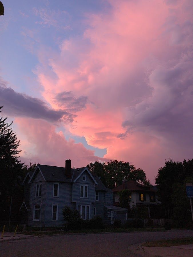 a very bright pink/orange sunset with dramatic clouds
