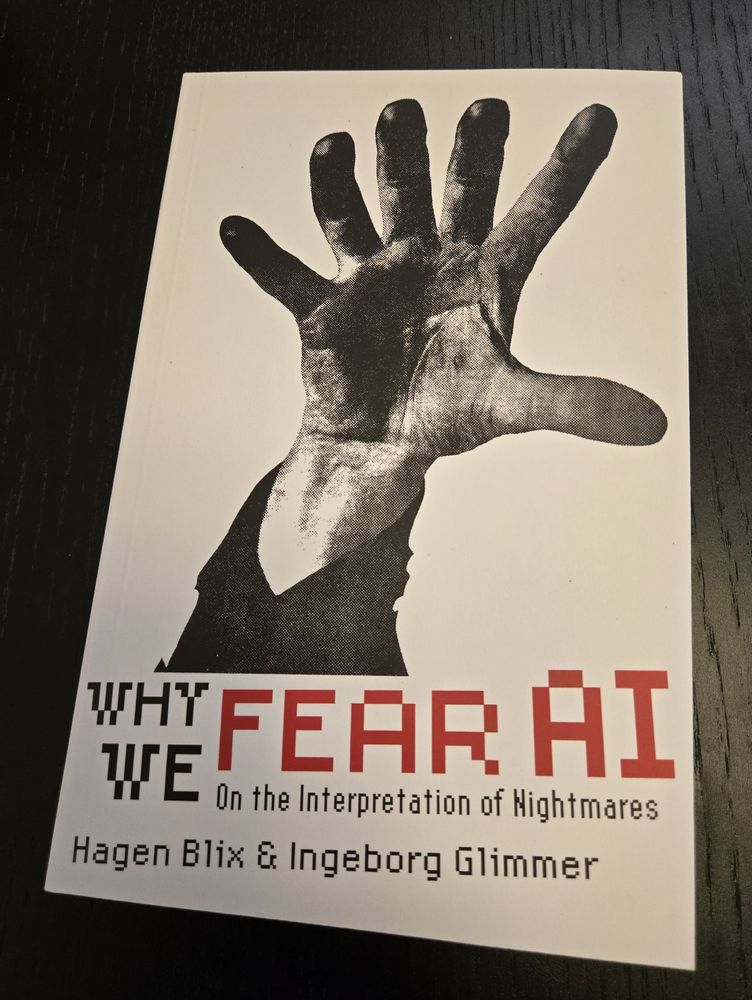 A book with a six-fingered hand (designed by Josh MacPhee), titled "Why We Fear AI: On the Interpretation of Nightmares"