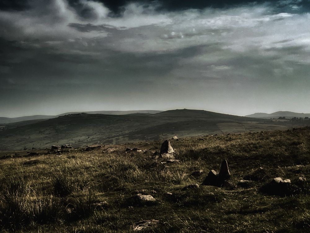 Grey & brown toned photo of Bronze Age wall on Dartmoor