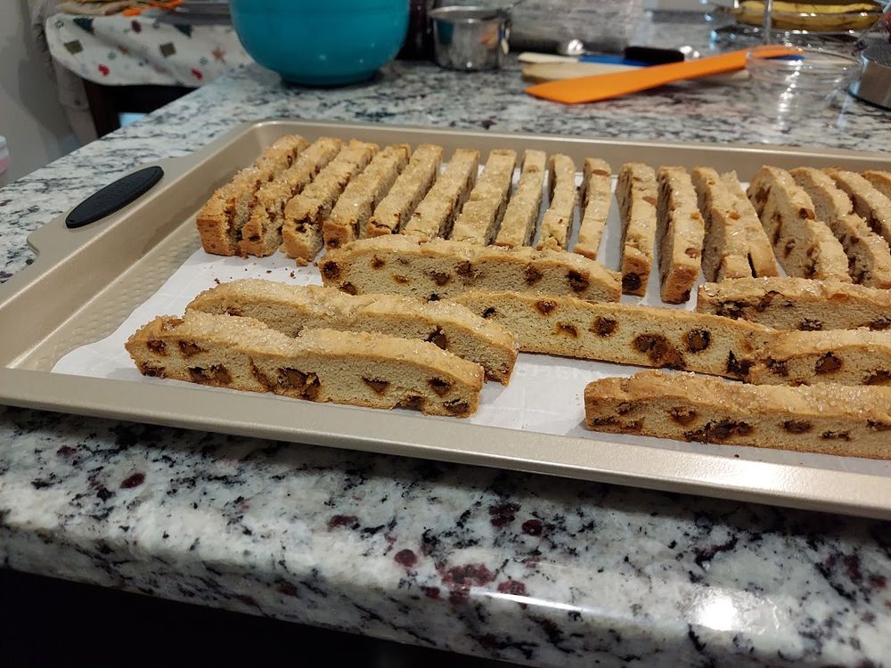 Baking sheet showing cut biscotti after the second baking. They were cut too thin but I think on the margin of acceptable. I'll probably cut second batch this thin too, even though it was a bit of pain to separate and stand them upright for second baking and they wanted to fall apart. Lessons were learned.